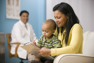 Mom and child with doctor looking on