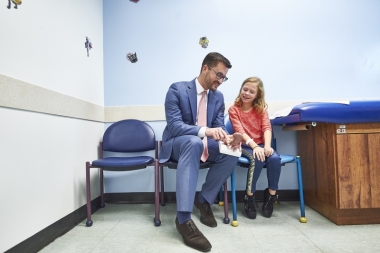 Doctor talking with child